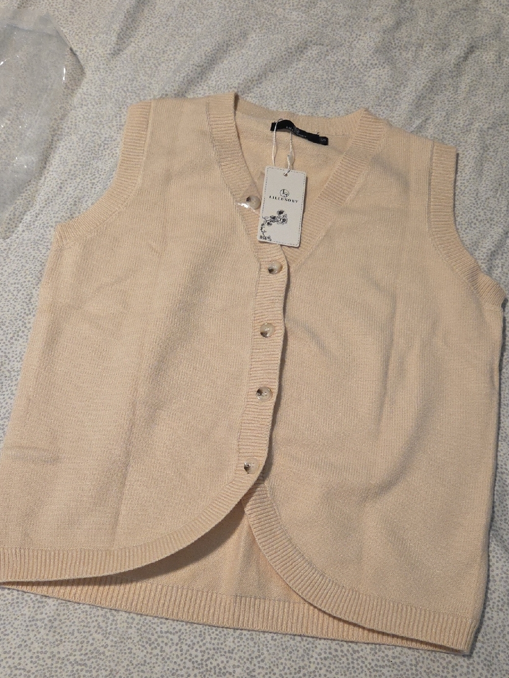 Sleeveless Button-Front Knit Vest — Cream